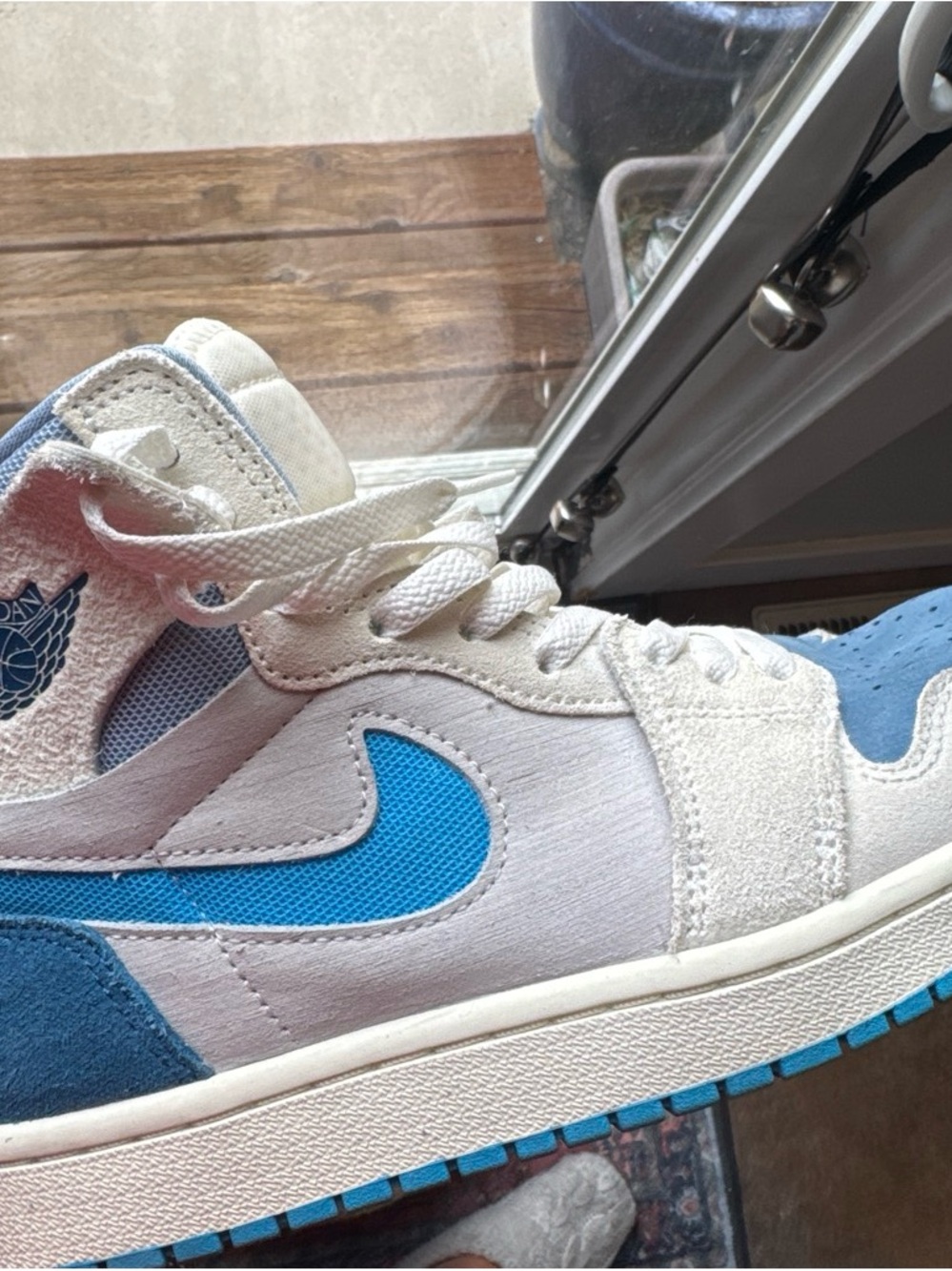 Jordan 1 Men’s High-Top Sneakers in cream and Blue